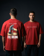 Still Here. Still Building — Oversized Tee