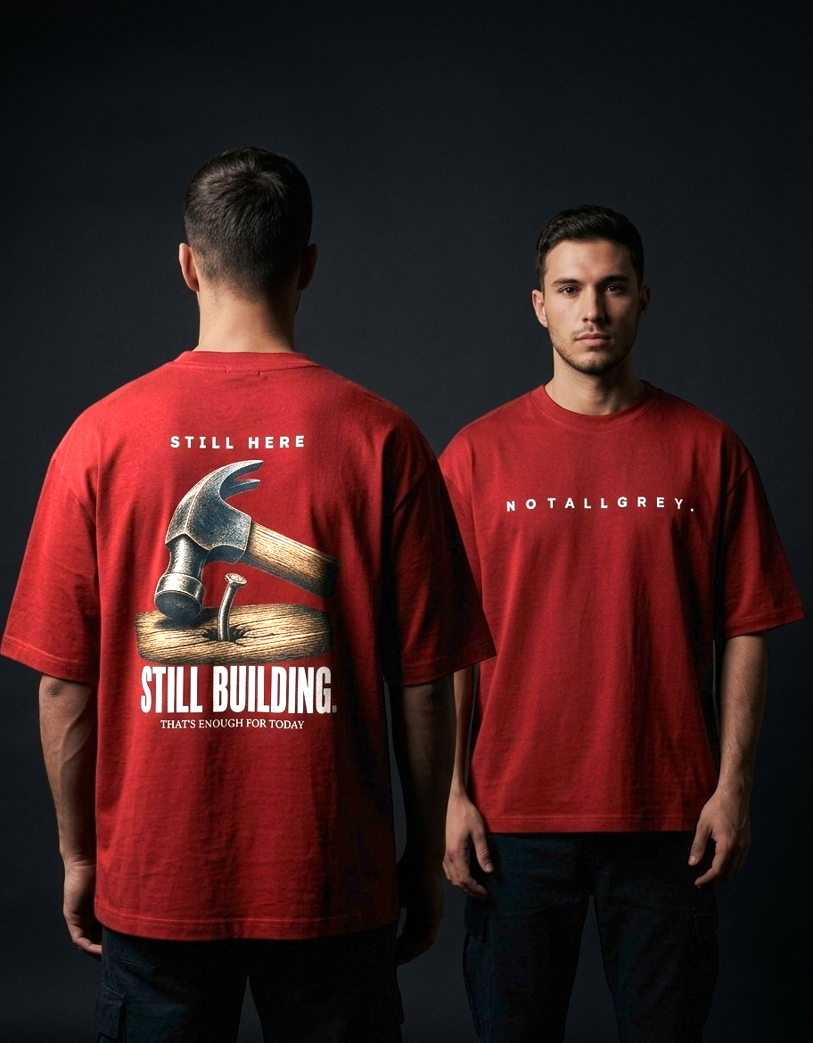 Still Here. Still Building — Oversized Tee