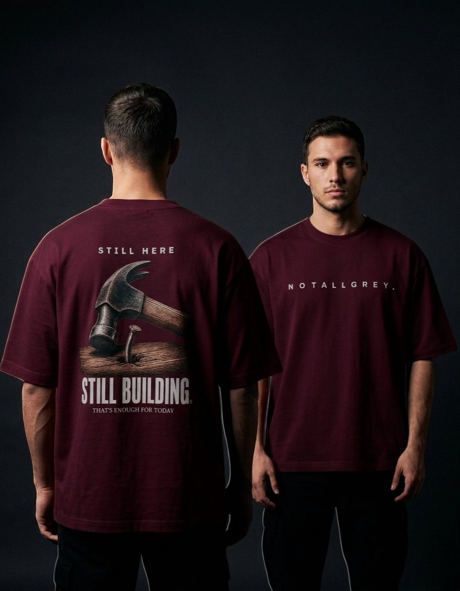 Still Here. Still Building — Oversized Tee